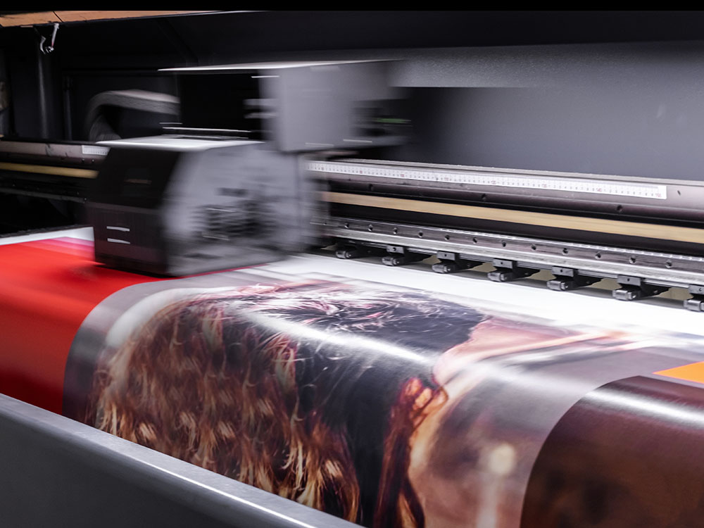 Colorful photos being printed on digital printer