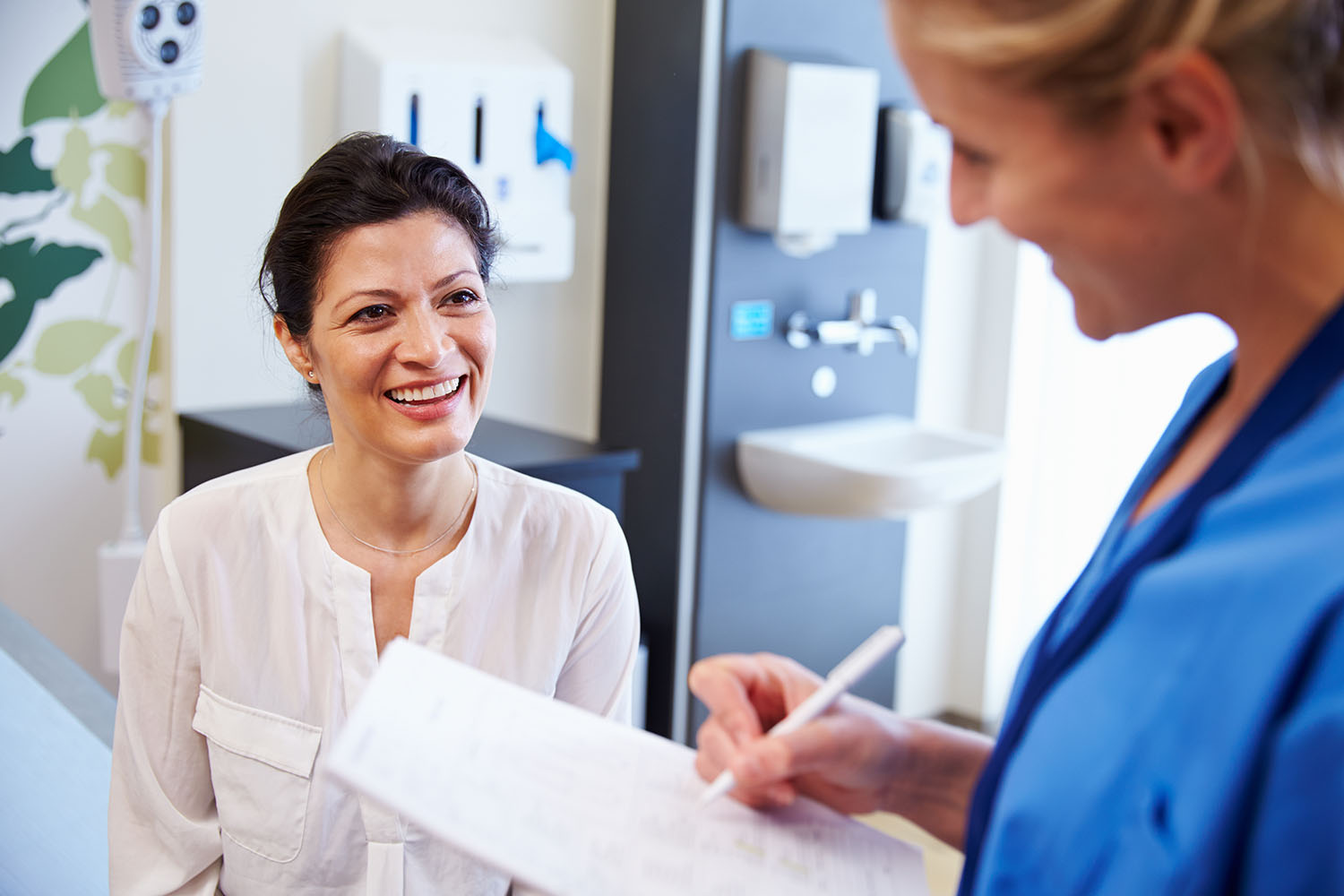 Dermatology patient smiling at doctor